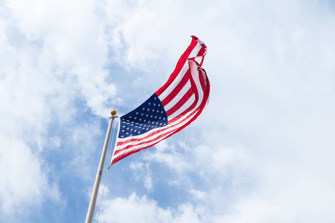 Photo by Brandon Day flag of USA with flag pole